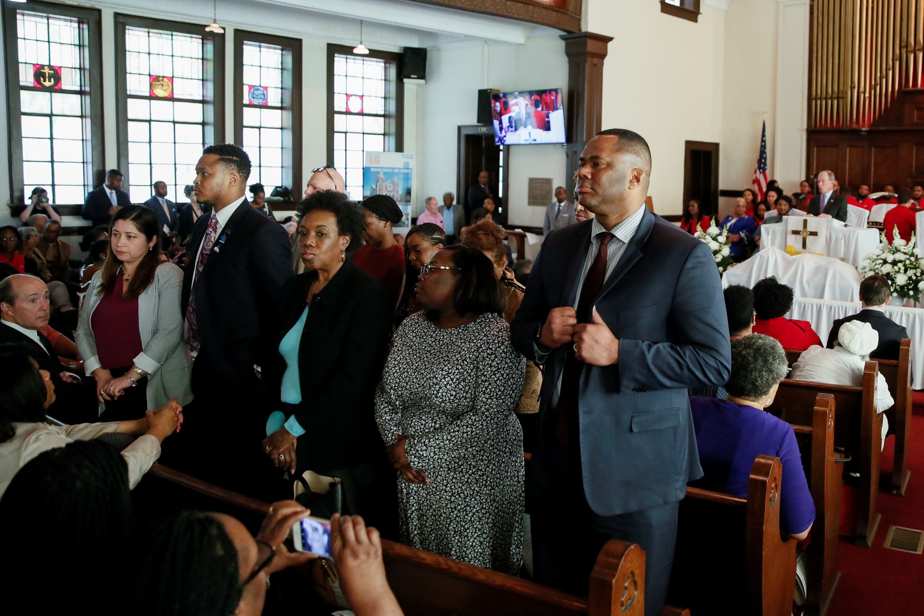 Churchgoers in Selma turn their backs on Bloomberg during service.