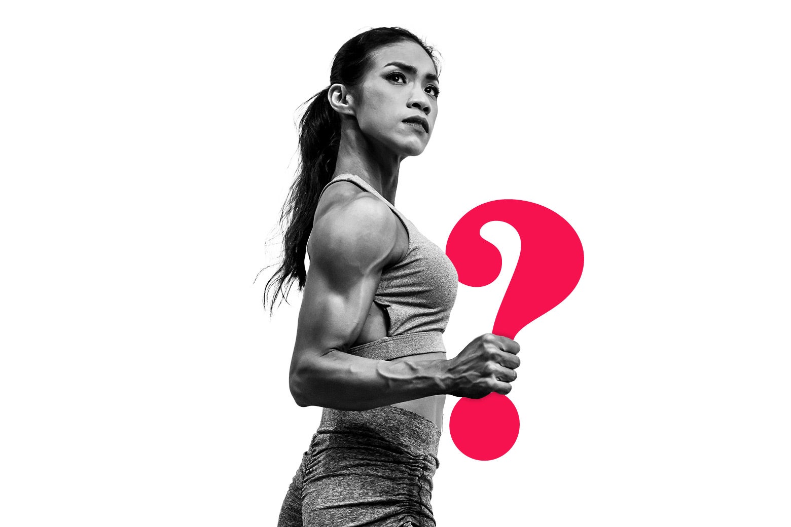 A muscular young woman holds a question mark.