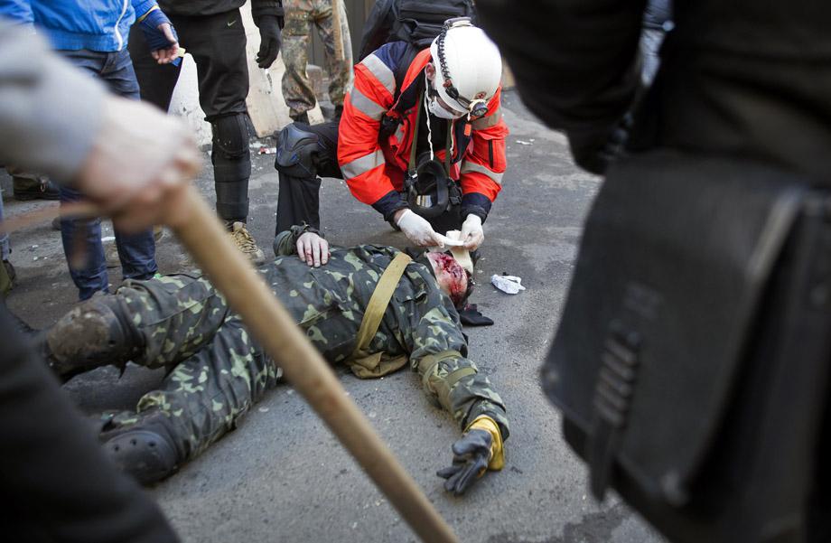 A protester who was injured during clashes with government police receives medical treatment in Kiev on Feb.18, 2014. UKRAINE/