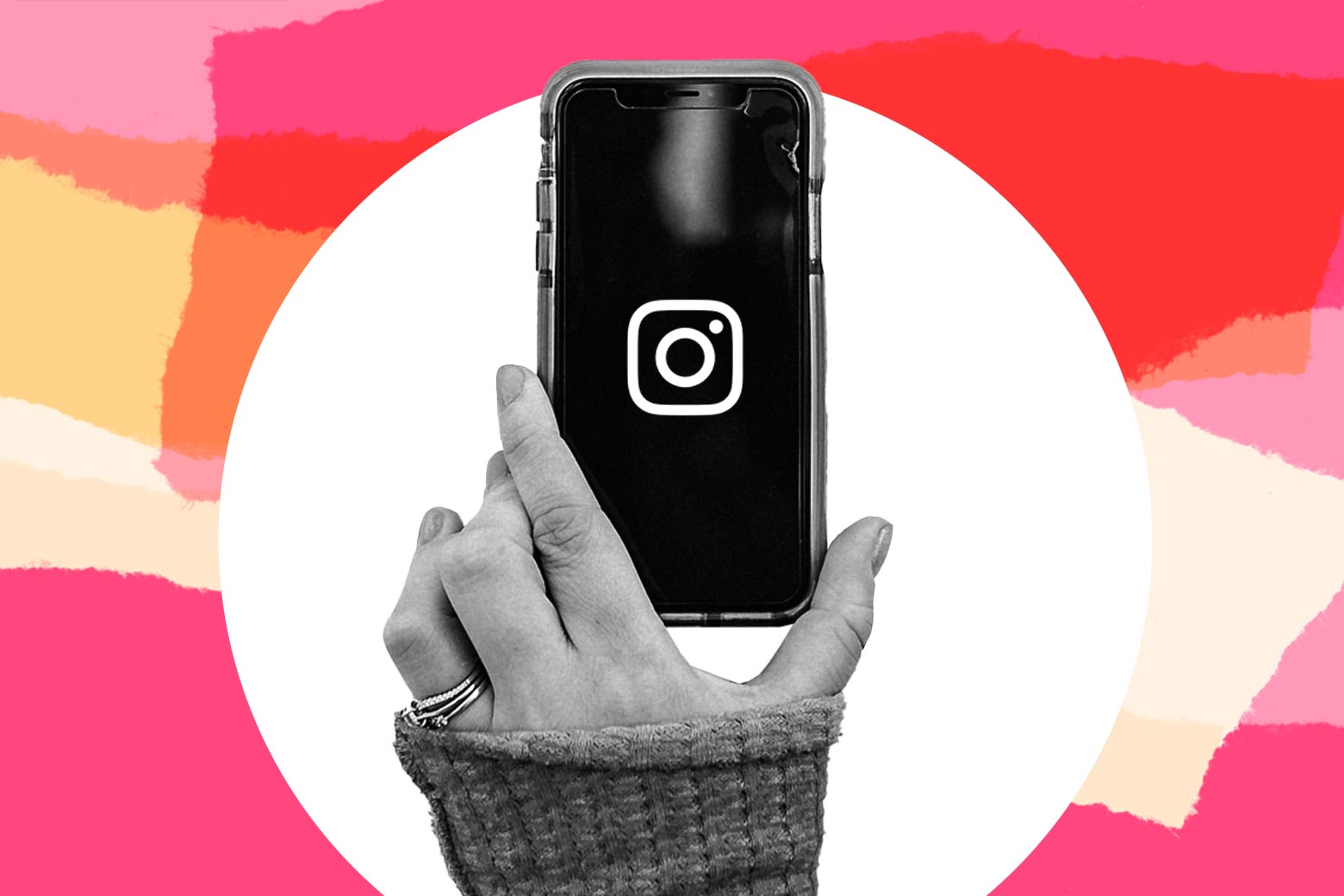 A hand holds a phone displaying the Instagram logo over a colored background.