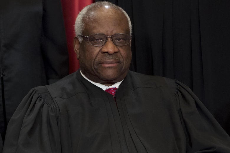 Clarence Thomas in a black robe.