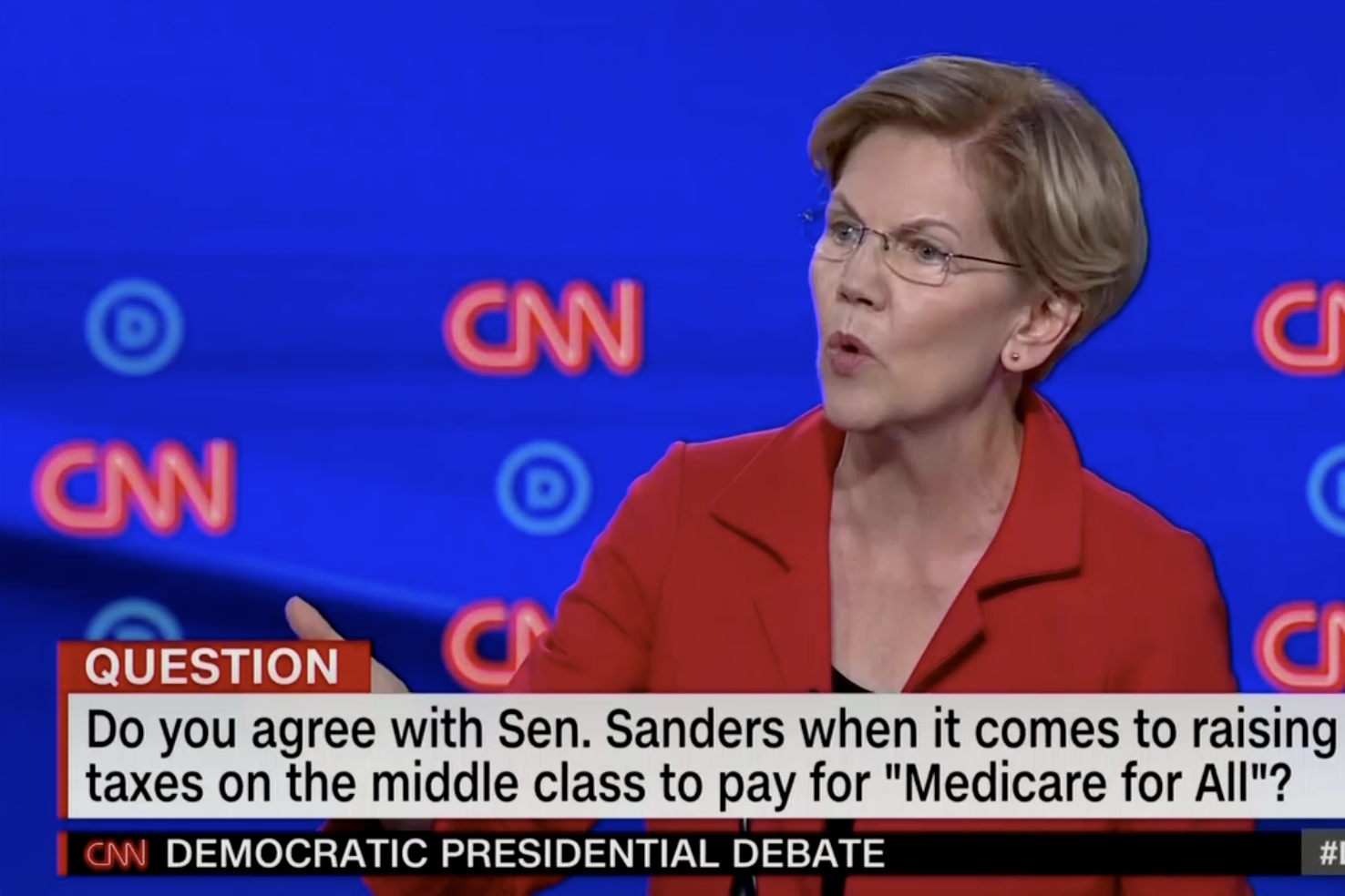 In this screengrab from CNN, Elizabeth Warren debates. The banner reads: "Do you agree with Sen. Sanders when it comes to raising taxes on the middle class to pay for 'Medicare for All'?"