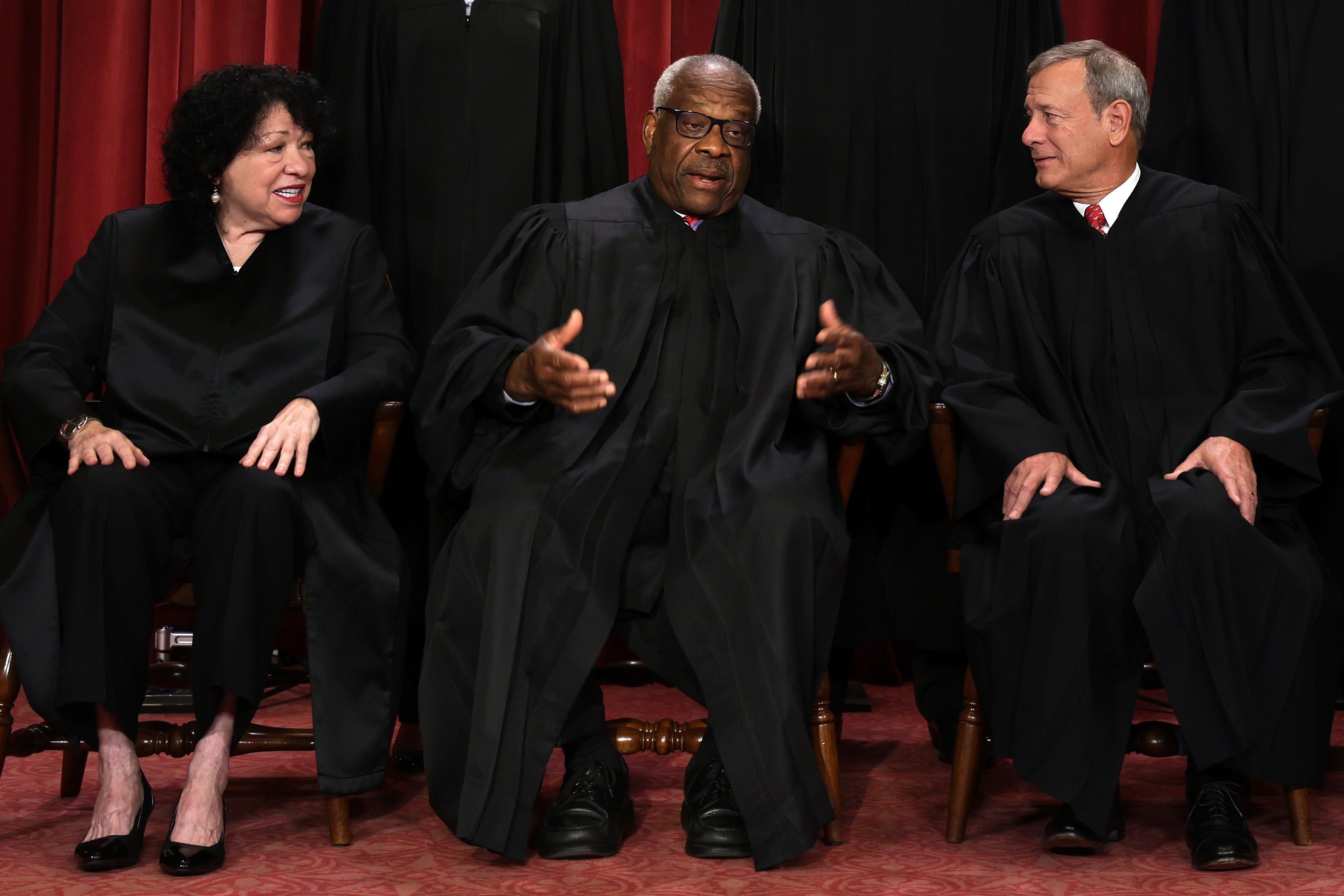 Sotomayor and Thomas are talking and Roberts looks like he's listening.