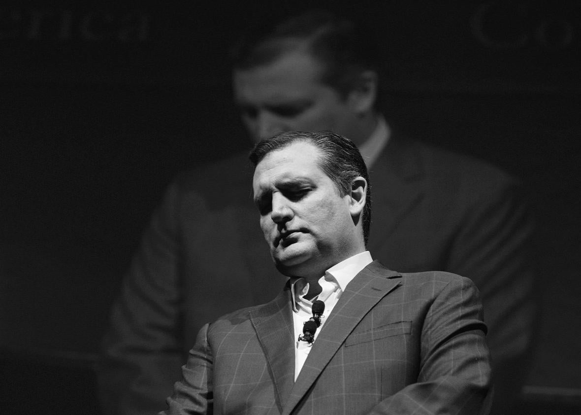 Texas Sen. Ted Cruz stands for a moment of silence before his ra