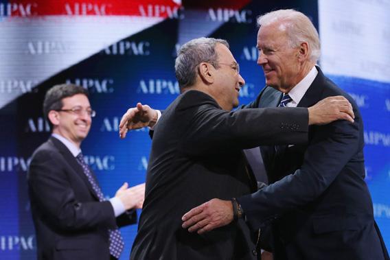 Vice President Joe Biden (R) embraces Israel Defense Minister Ehud Barak (C).