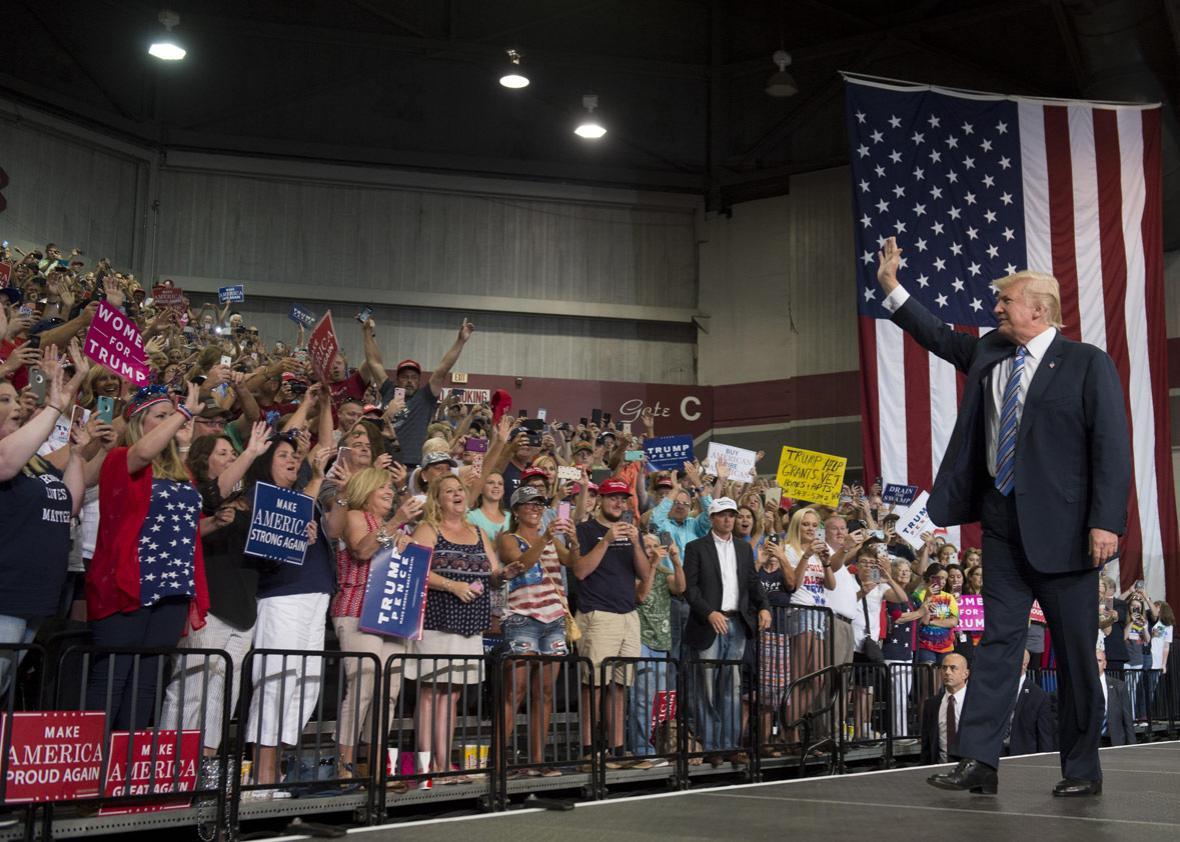 US President Donald Trump arrives to speak at a Make America Great Again Rally at Big Sandy Superstore Arena in Huntington, West Virginia, August 3, 2017. 