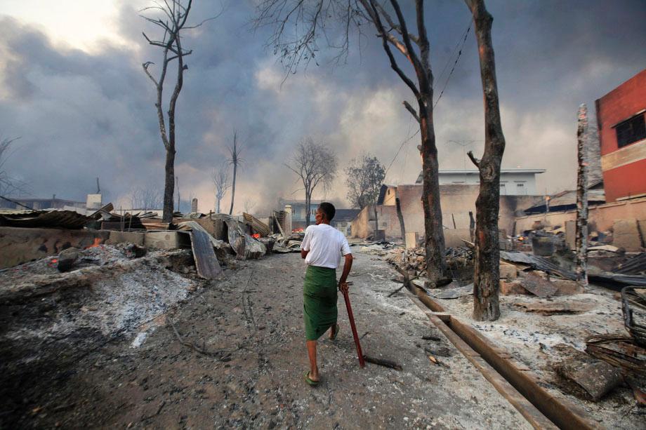 A man walks in Meikhtila, Burma on March 21, 2013. The central Burmese town declared a curfew for a second night on Thursday after clashes killed 10 people, including a Buddhist monk, and injured at least 20, authorities said. 