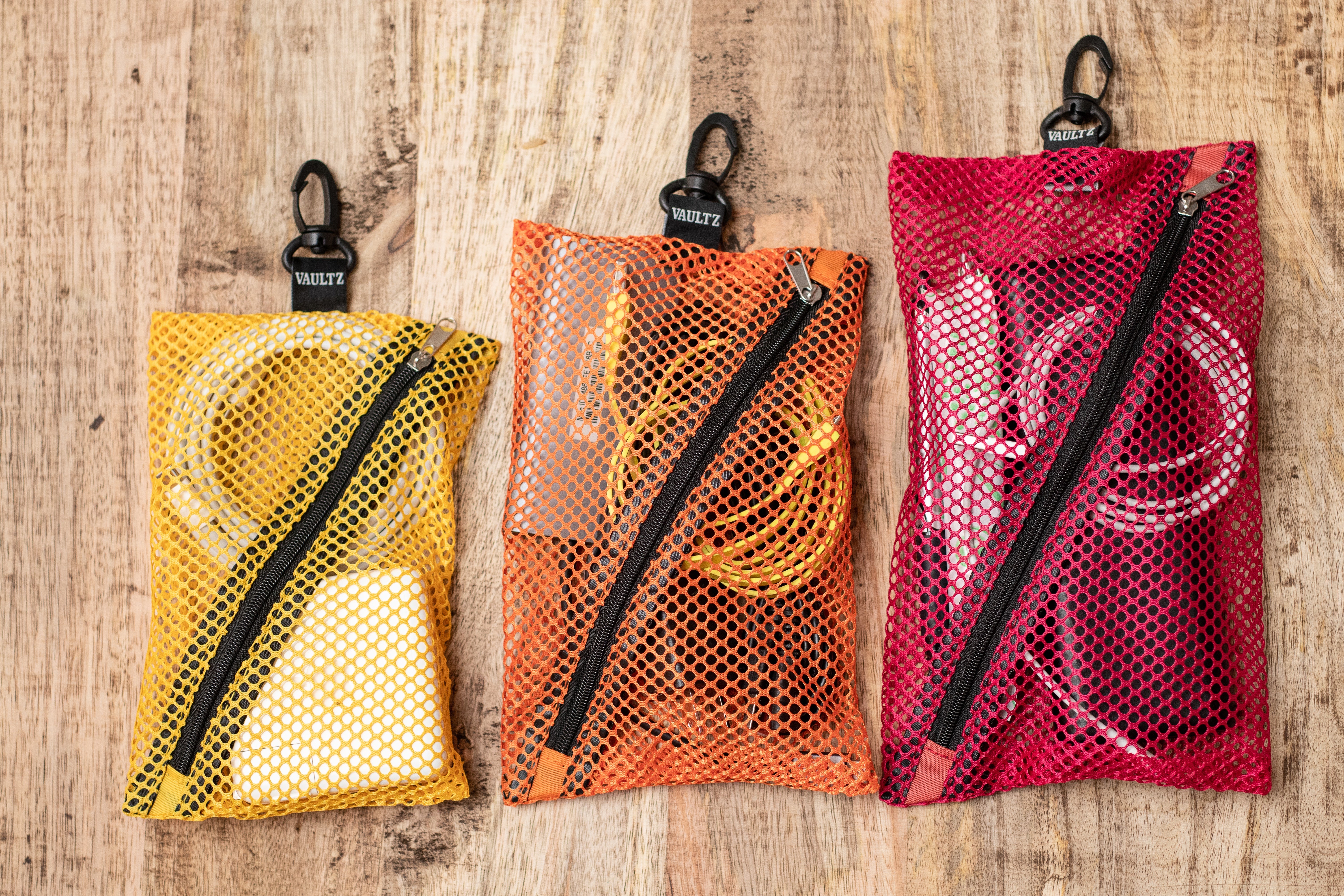 A multipack of colors of Vaultz Mesh Storage Bags