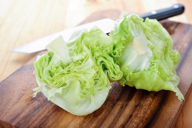A head of iceberg lettuce, cut in half.