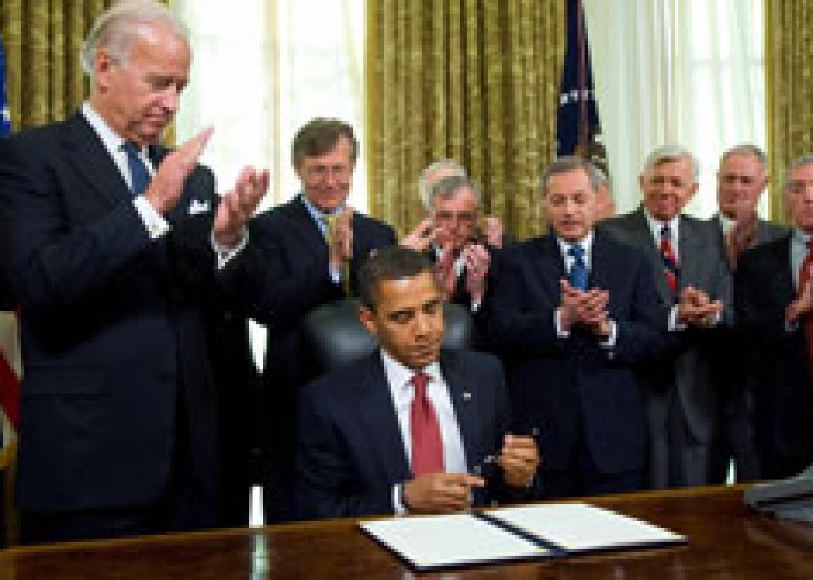 US President Barack Obama puts his pen away after signing an executive order. Click image to expand.