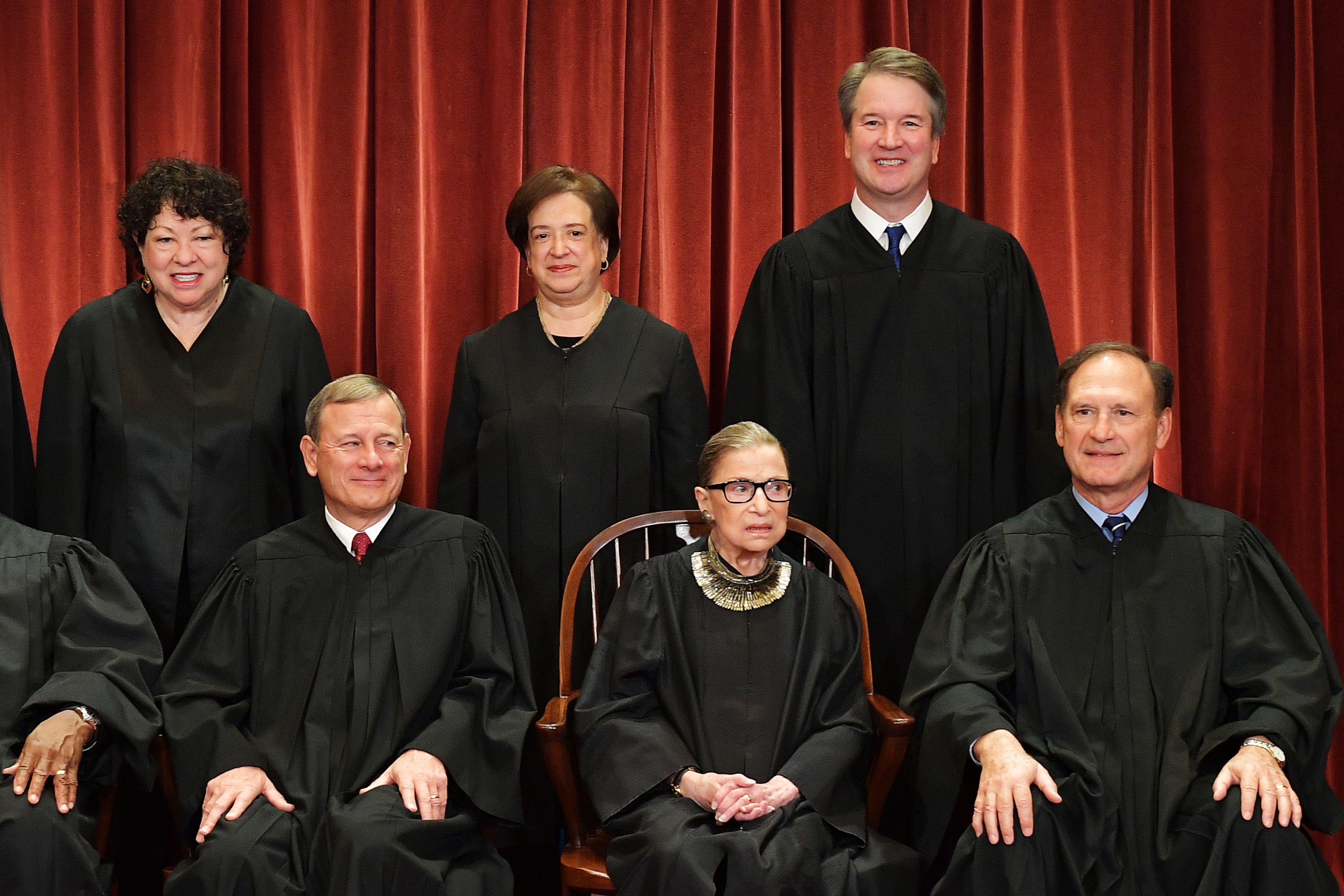 Seated from left: Chief Justice John Roberts with Associate Justices Ruth Bader Ginsburg and Samuel Alito. Standing from left: Associate Justices Sonia Sotomayor, Elena Kagan, and Brett Kavanaugh.