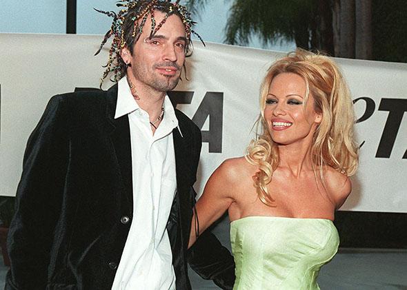 Pamela Anderson Lee arrives at the People for the Ethical Treatment of Animals awards with her husband Tommy Lee in September 1999 in Los Angeles.