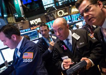 Traders work on the floor of the New York Stock Exchange on March 4, 2014.