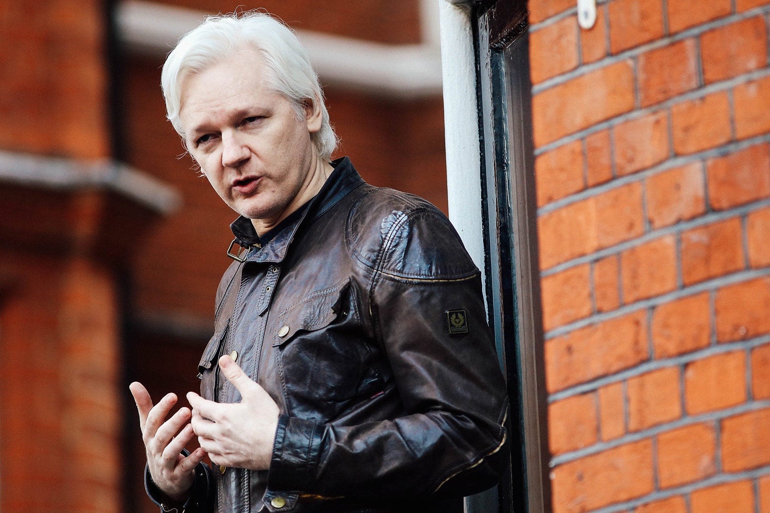 Julian Assange speaks to the media from the balcony of the Embassy of Ecuador on May 19 in London.