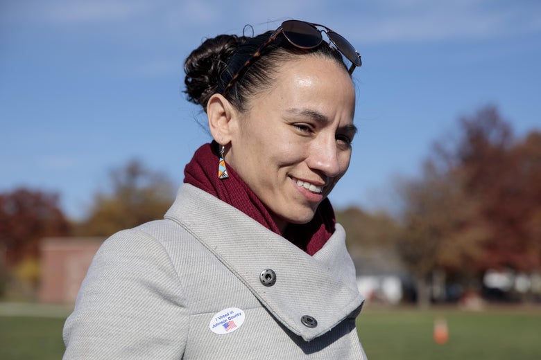 A smiling Sharice Davids is seen outside.