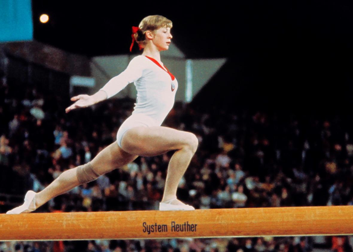 USSR champion Olga Korbut, aged 15, performs on the beam on September 09, 1972 during the Olympic Gymnastics individual event in Munich where she captured four gold medals. 