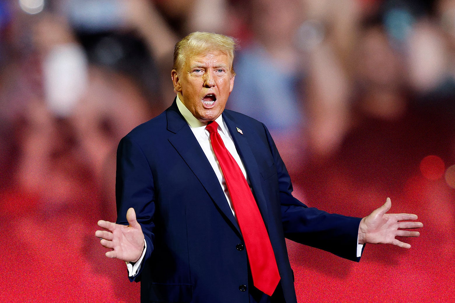 Donald Trump yelling at a rally, his hands outstretched.