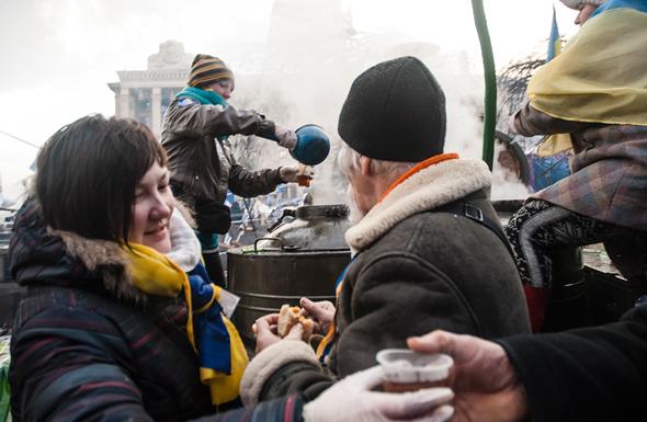 Protesters drink free "hot Volyn tea" at Independence Square.
