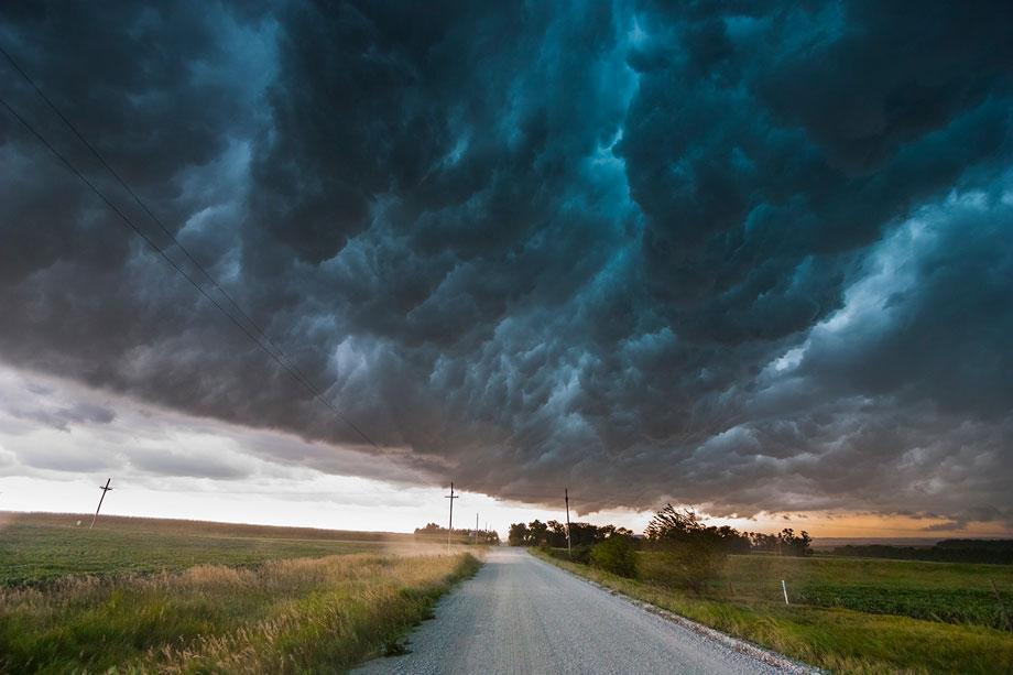 A shelf cloud moves over a storm chaser, producing a "whale's mouth" in southeast Nebraska, Aug. 9, 2009.