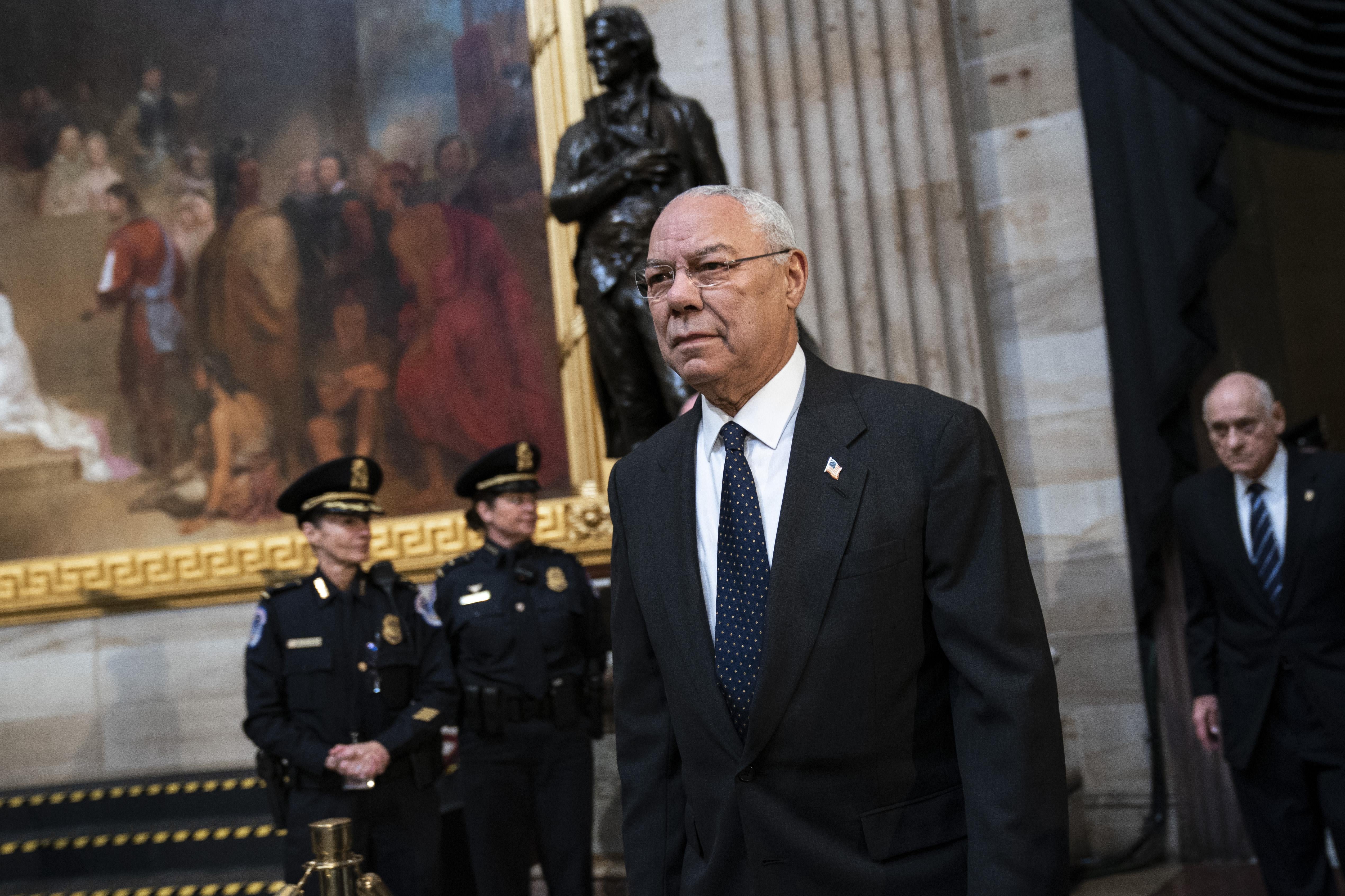 Colin Powell arrives to pay his respects at the casket of the late former President George H.W. Bush as he lies in state at the Capitol