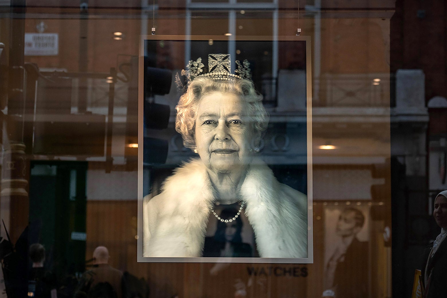 A portrait of Queen Elizabeth II displayed as a tribute in the window of a department store in London. 