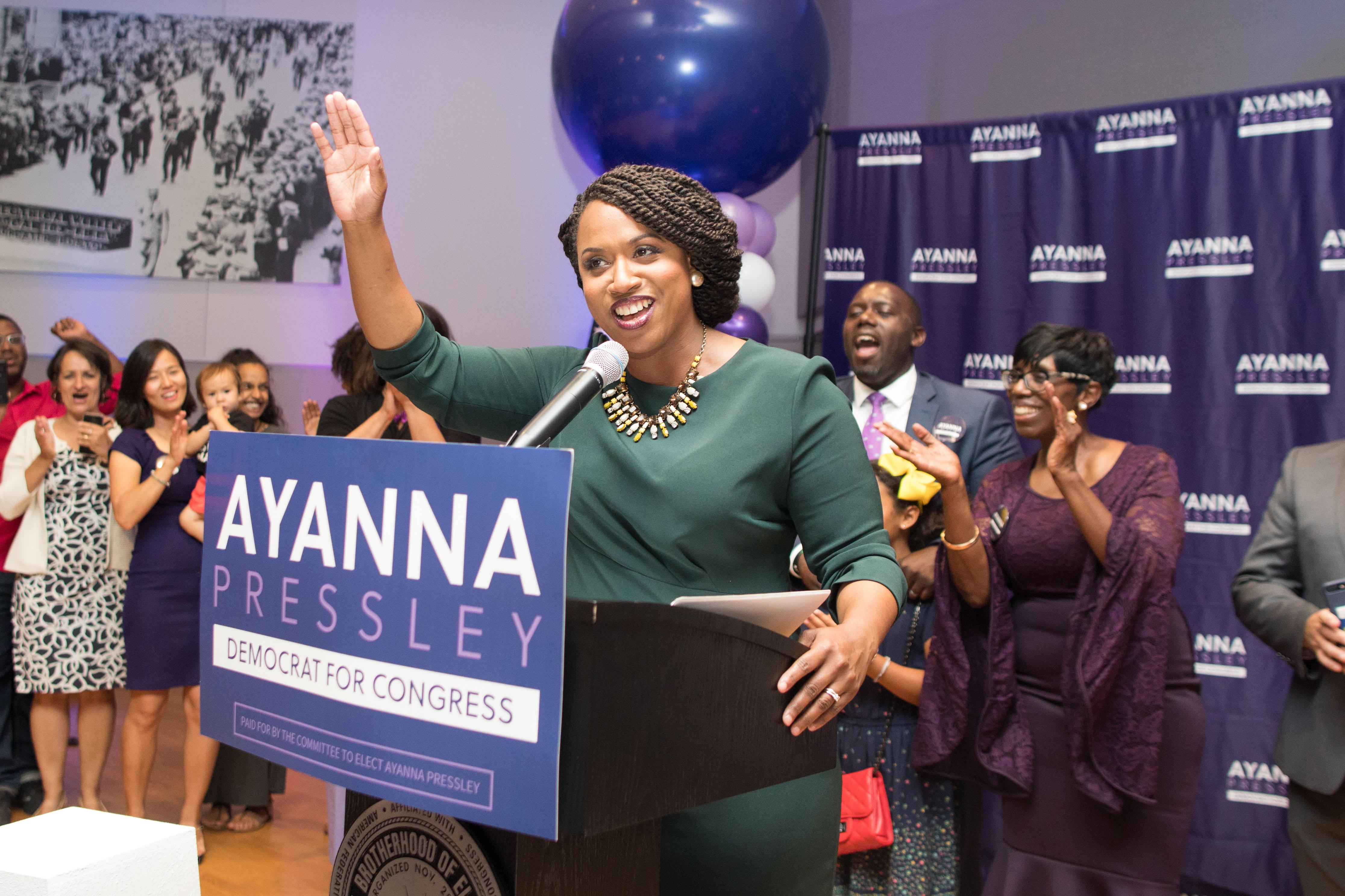 Ayanna Pressley surrounded by balloons and cheering supporters