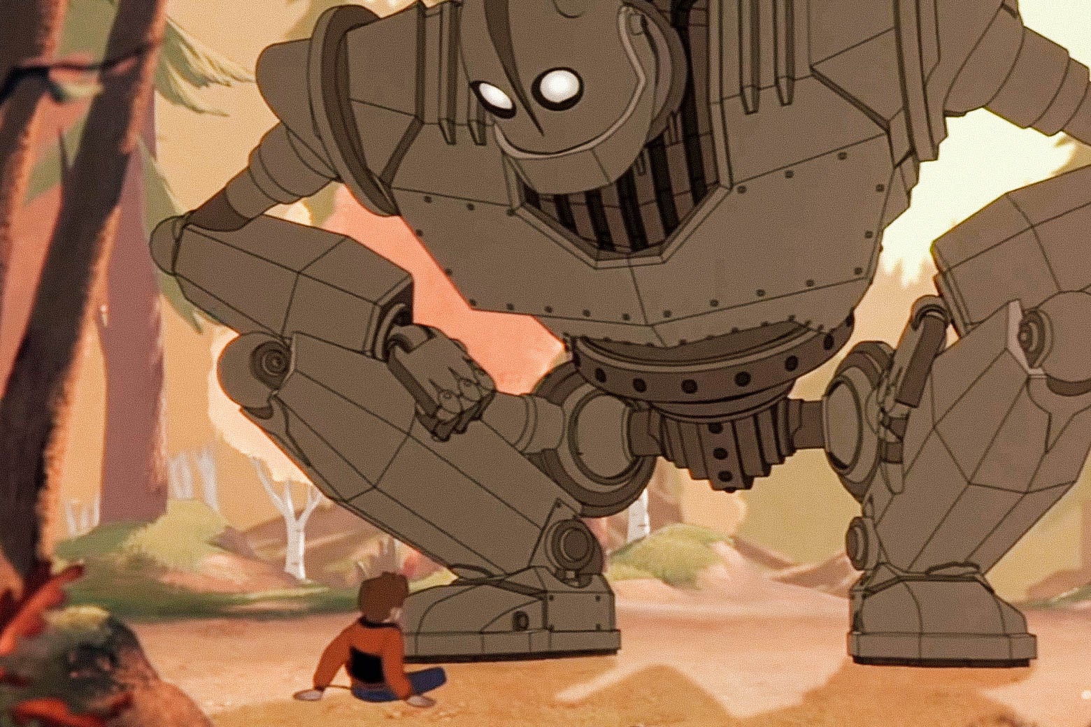A giant cartoon robot looking down at a boy in The Iron Giant