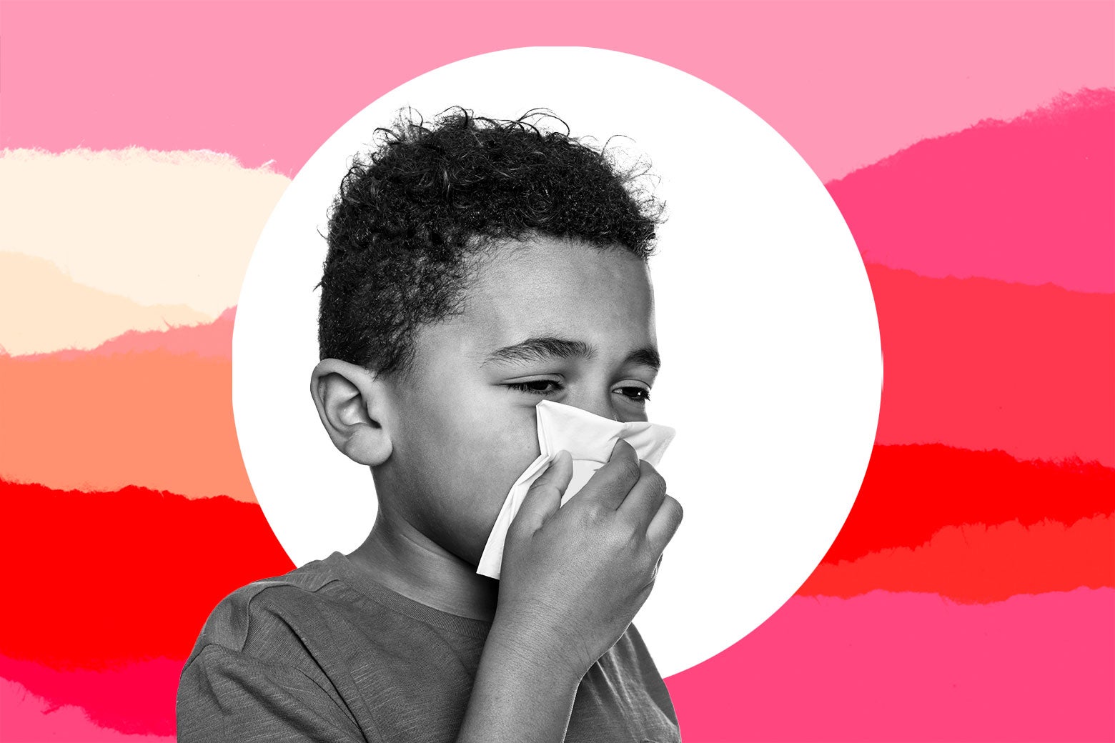 A child blowing his nose 