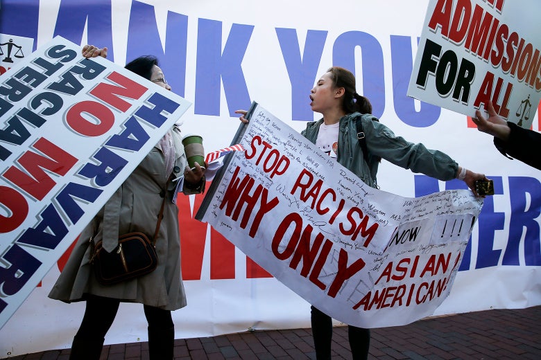 A scuffle between protesters ensues as a group of Chinese Americans who support President Trump raised a banner thanking the president at a rally in Boston to support SFFA’s lawsuit against Harvard on Sunday.