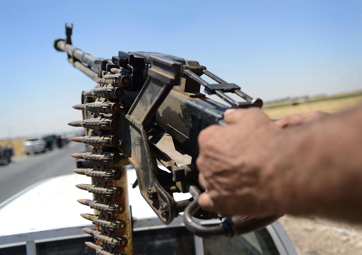 A member of Peshmerga forces in action during the clashes with ISIS militants on August 10, 2014 in Mosul, Iraq. 
