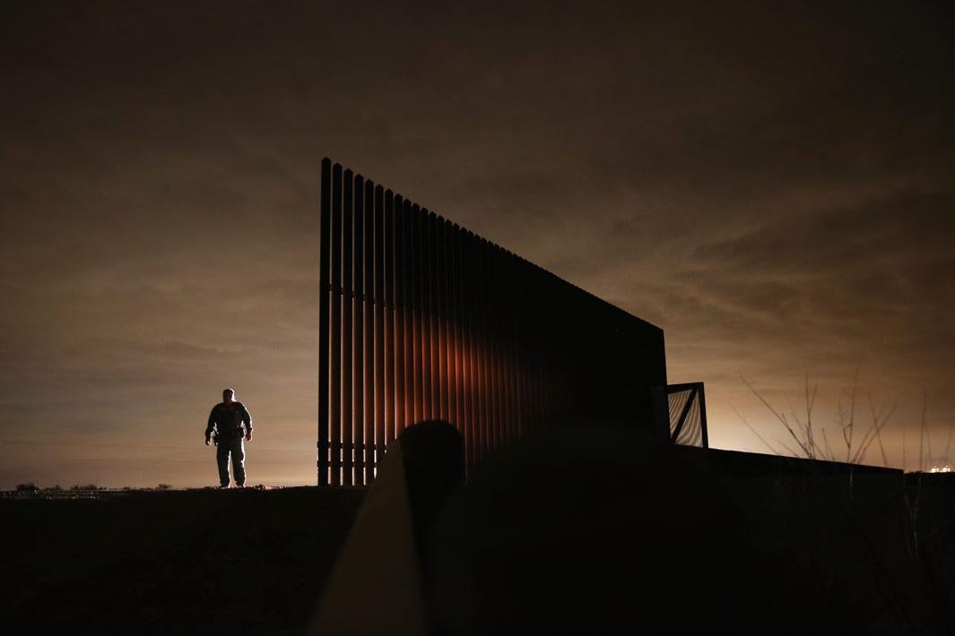 La Joya, Texas U.S. Border Patrol agent Sal De Leon stands near a section of the U.S.- Mexico border fence while stopping on patrol on April 10, 2013 in La Joya, Texas. According to the Border Patrol, undocumented immigrant crossings have increased more than 50 percent in Texas' Rio Grande Valley sector in the last year. Border Patrol agents say they have also seen an additional surge in immigrant traffic since immigration reform negotiations began this year in Washington D.C. Proposed refoms could provide a path to citizenship for many of the estimated 11 million undocumented workers living in the United States.