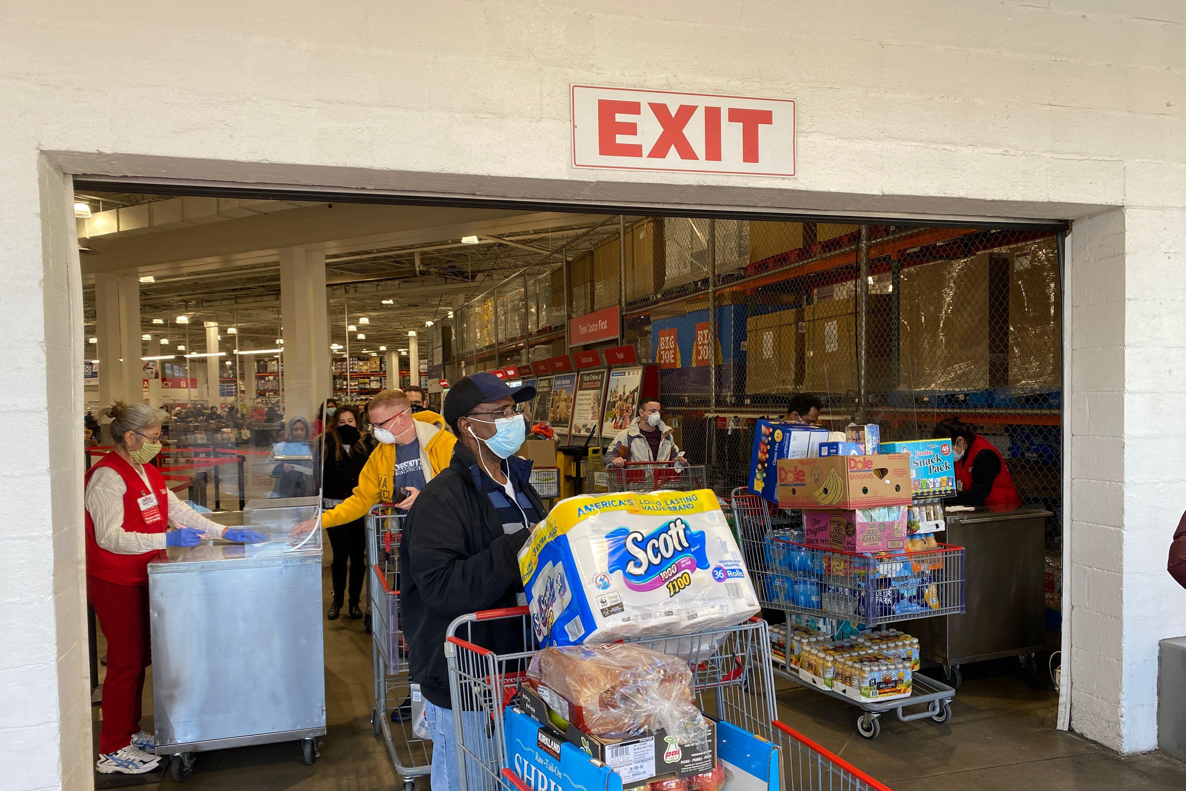 Shoppers wear masks as they get supplies at a Costco on April 18, 2020, in Arlington, Virginia. 
