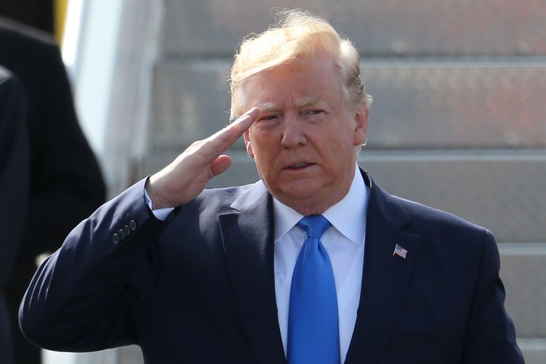 President Donald Trump salutes as he disembarks Air Force One in the United Kingdom on June 3.