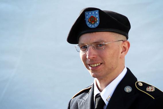 U.S. Army Private Bradley Manning is escorted as he leaves a military court at the end of the first of a three-day motion hearing June 6, 2012 in Fort Meade, Maryland.