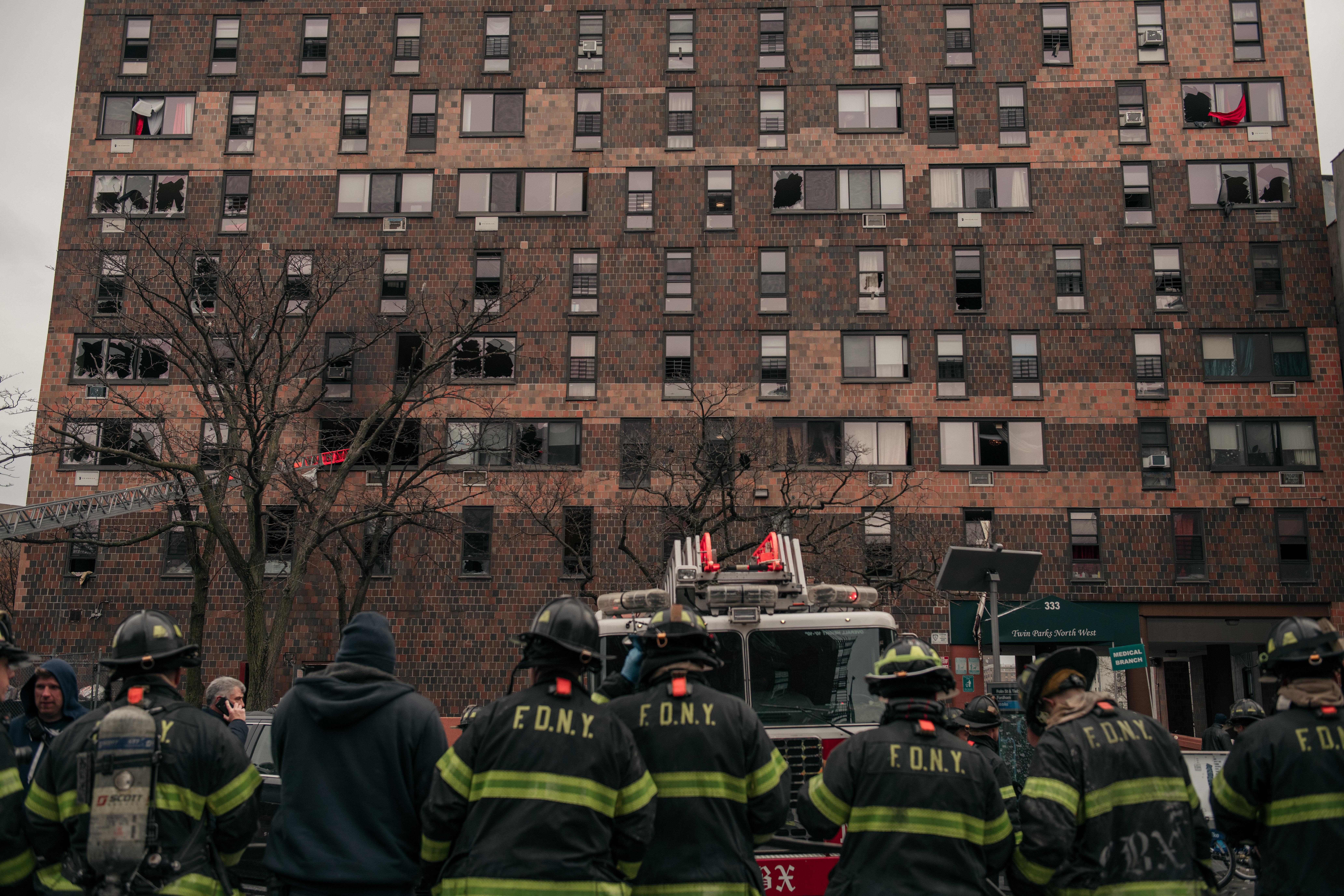 Emergency first responders remain at the scene after an intense fire at a 19-story residential building that erupted in the morning on January 9, 2022 in the Bronx borough of New York City. 