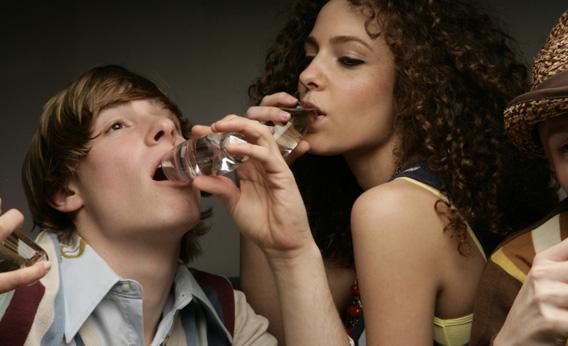 man and woman enjoying a drink.
