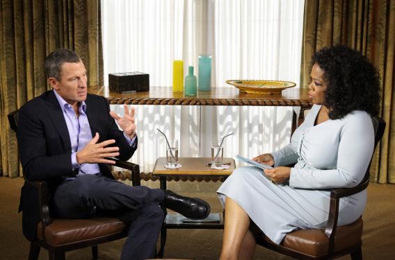 Oprah Winfrey speaks with Lance Armstrong during an interview regarding the controversy surrounding his cycling career.
