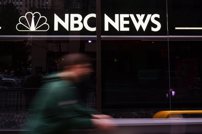 A pedestrian walks past the NBC News studios, Nov. 29, 2017 in New York City. 