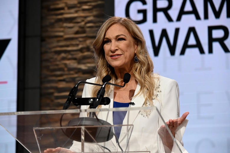 Deborah Dugan standing behind a podium.