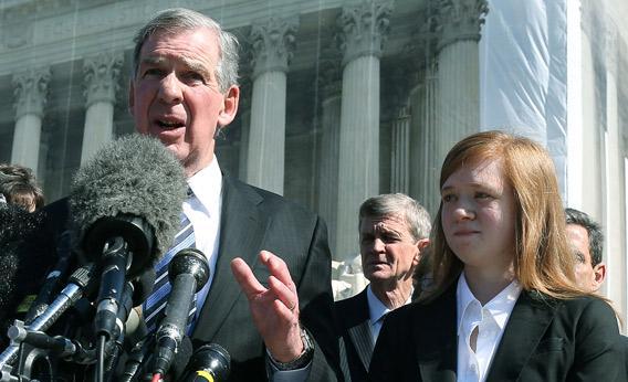 Attorney Bert Rein (L), speaks to the media while standing with plaintiff Abigail Noel Fisher (R), after the U.S. Supreme Court heard arguments.