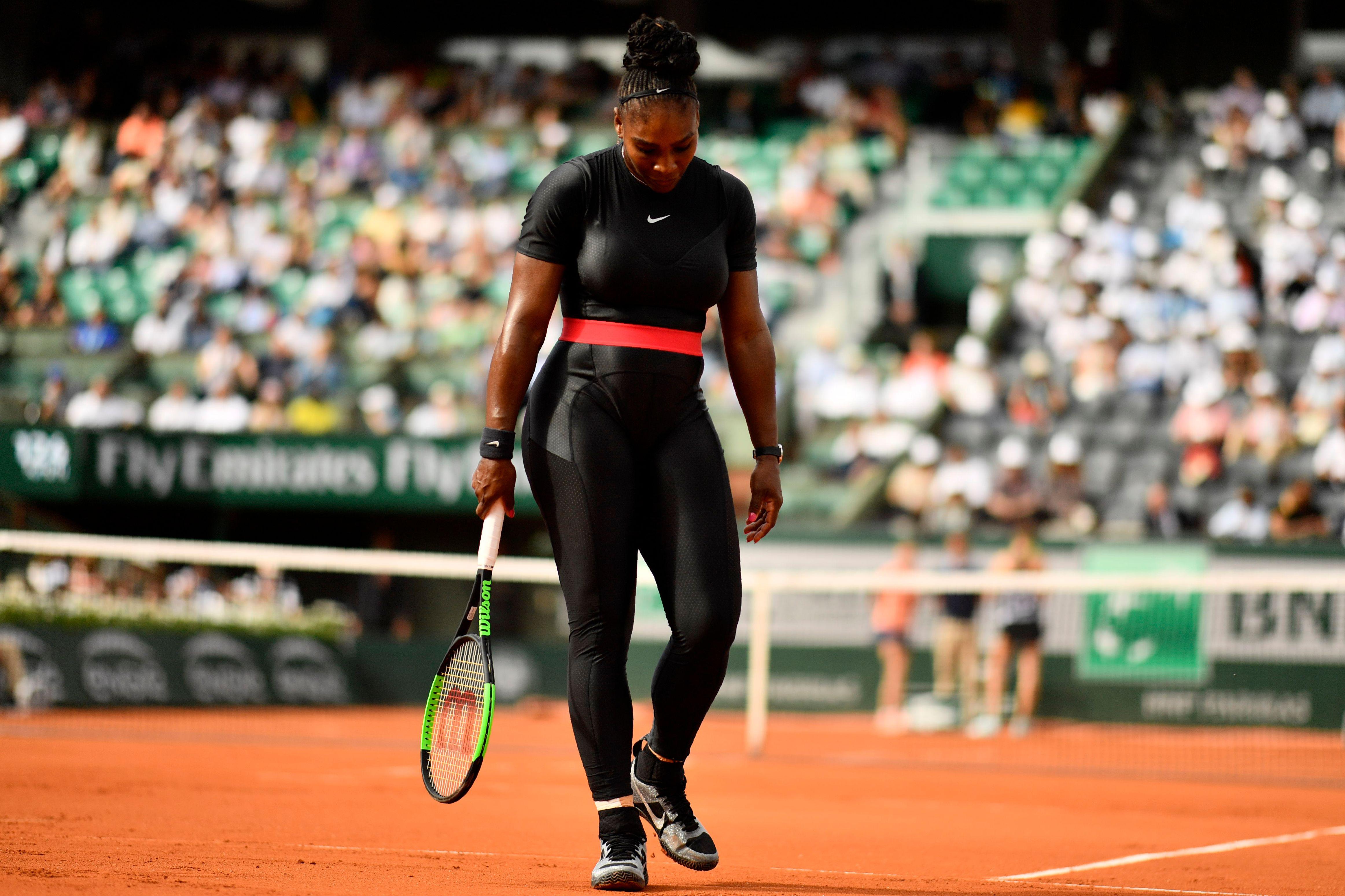 Serena Williams of the US walks on court after a point against Czech Republic's Kristyna Pliskova during their women's singles first round match on day three of The Roland Garros 2018 French Open tennis tournament in Paris on May 29, 2018. (Photo by CHRISTOPHE SIMON / AFP)        (Photo credit should read CHRISTOPHE SIMON/AFP/Getty Images)