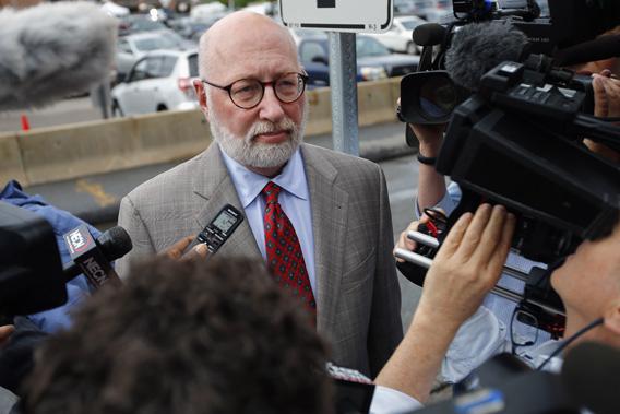 J.W. Carney, defense attorney for accused mob boss James "Whitey" Bulger, talks to reporters as he arrives at the U.S. Federal Courthouse for the start of Bulger's trial in Boston.