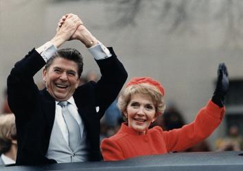 Ronald Reagan and Nancy Reagan waving from their limousine during the Inaugural Parade in Washington, D.C. on Inauguration Day, 1981.