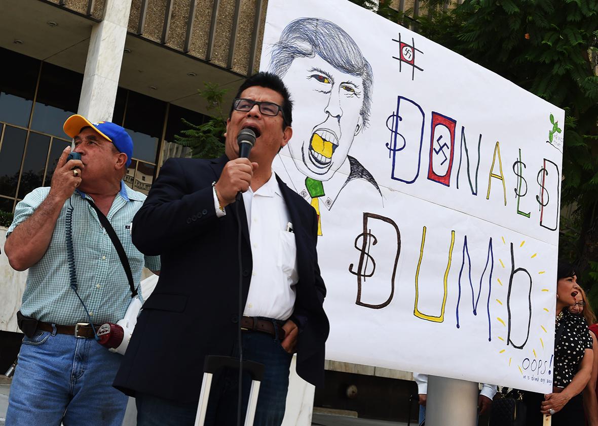 Juan Jose Gutierrez leads a coalition of Latino community leaders in a protest against the policies of Republican presidential hopeful Donald Trump, outside the Federal Building in Los Angeles, California on August 19, 2015. 
