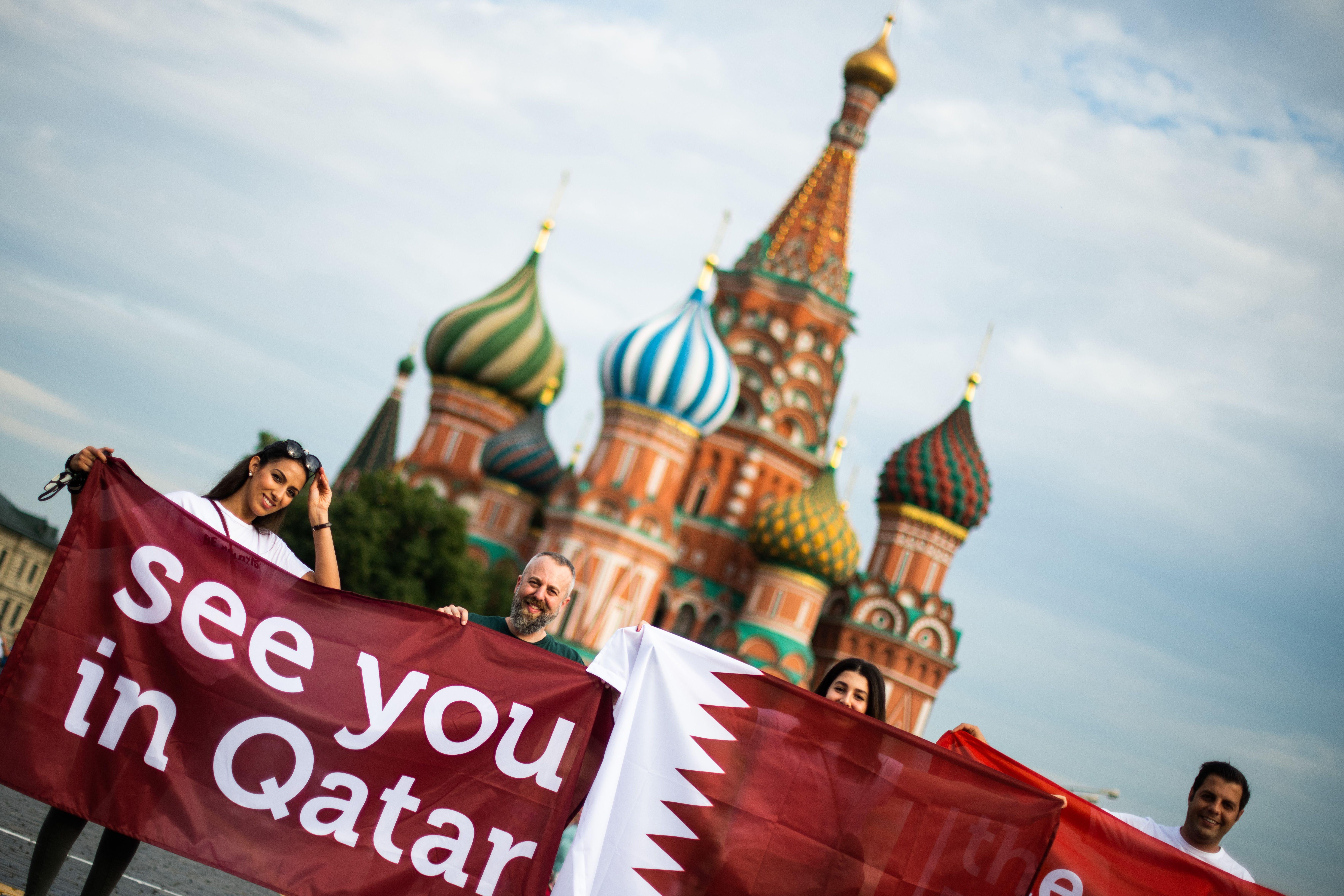 A group of people display a banner reading 'See you in Qatar' in reference to the Qatar 2022 World Cup at the Red Square in Moscow on July 14, 2018 on the eve of the Russia 2018 World Cup final football match between France and Croatia. (Photo by Jewel SAMAD / AFP)        (Photo credit should read JEWEL SAMAD/AFP/Getty Images)