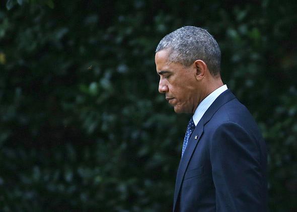 President Obama walks toward Marine One while departing the White House.