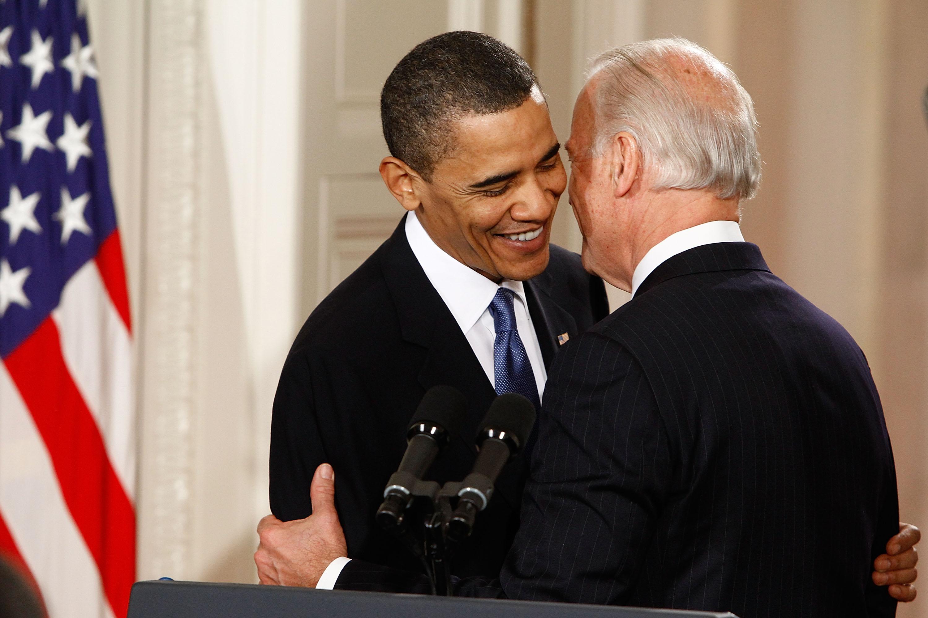 President Barack Obama is embraced by Vice President Joe Biden before signing the Affordable Health Care for America Act during a ceremony in the East Room of the White House March 23, 2010 in Washington, D.C.