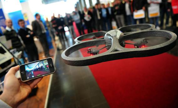 The AR Drone, a remote-controlled quadrotor helicopter with buit in camera and Wi-Fi, controlled by iPhone or iPod Touch
