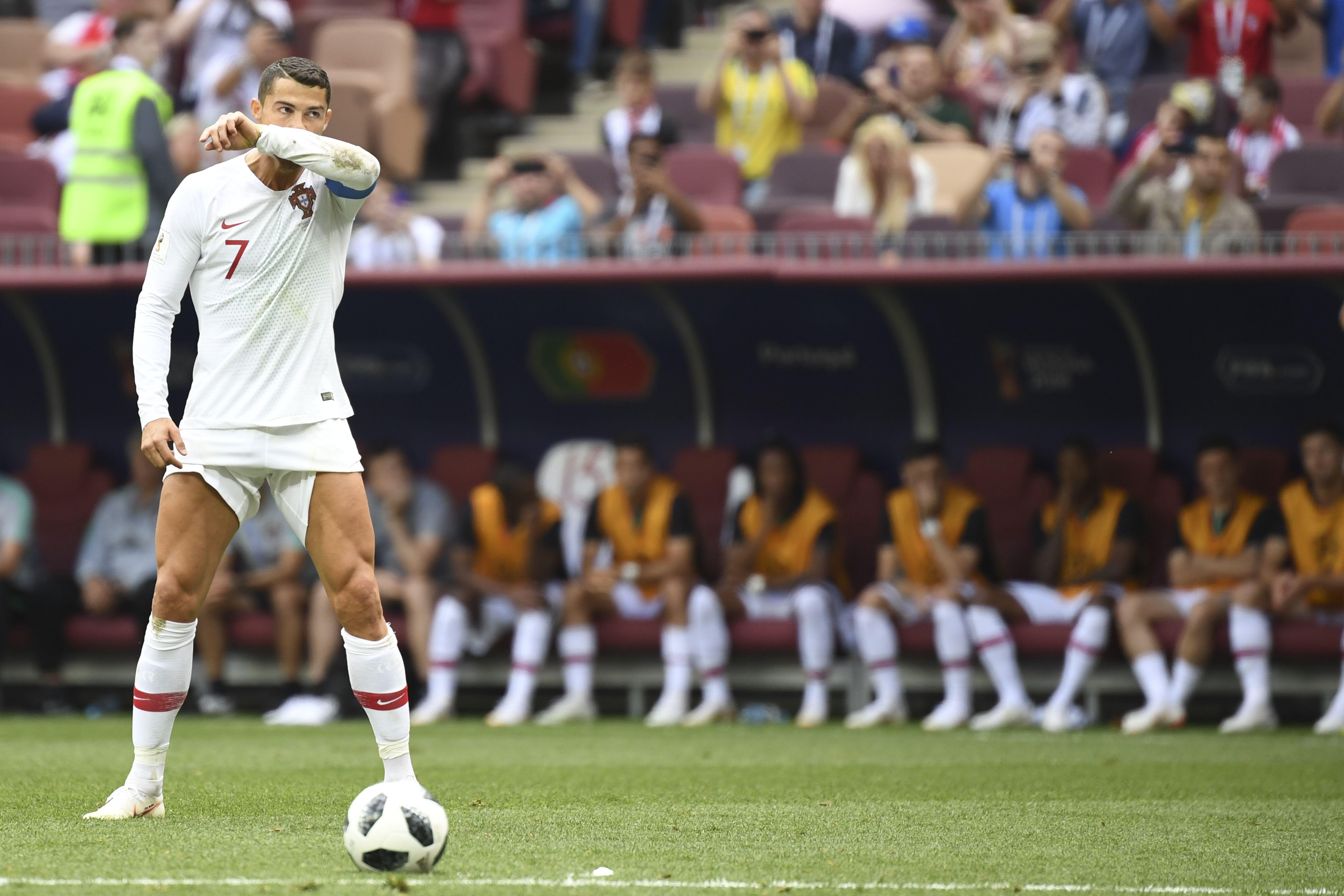 Portugal's forward Cristiano Ronaldo prepares to shoot a free kick.