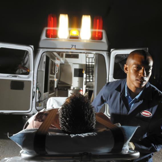 An EMT helping a patient.